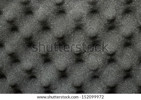 dark texture.black material background with glitter. synthetic. foam. unusual.