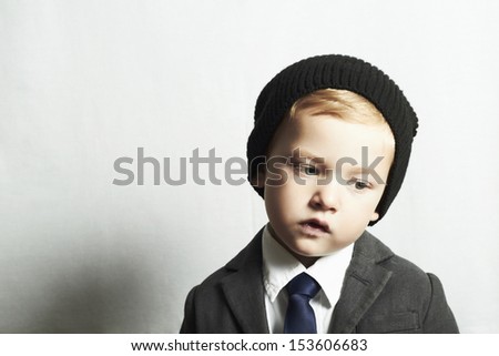 sad little boy in suit.style kid. fashion children. emotion