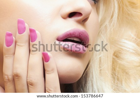 lips,nails and hair of beautiful blond woman. face.make-up.beauty salon