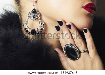 Jewelry and Beauty. beautiful woman.Fashion art photo.red lips.face without eyes.ornamentation. manicure