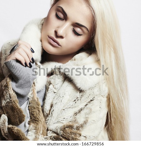 Beauty Fashion blond Model Girl in Mink Fur Coat. Beautiful Woman in Luxury Fur Jacket . Winter Fashion
