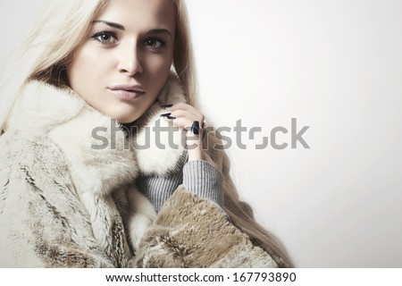 Beauty blond Model Girl in Mink Fur Coat.Beautiful Woman.Winter Style. your Text Here