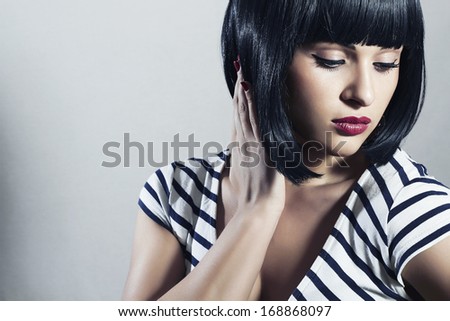 Beautiful Brunette Girl in Dress. Black Hair. bob Haircut. Red Lips. Beauty Woman with Fringe