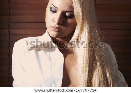 Beautiful Blond Woman. Business Woman after Work In Office. Wood Blinds Background. Beauty Sexy Girl