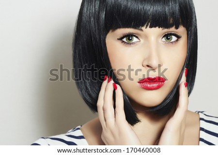 Beautiful Lovely Brunette Girl. Black Hair.Red Lips. Beauty Woman with Fringe.Red Manicure