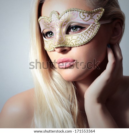 Beautiful Blond Woman in Carnival Mask.Masquerade. Sexy Girl. Lovely Lady