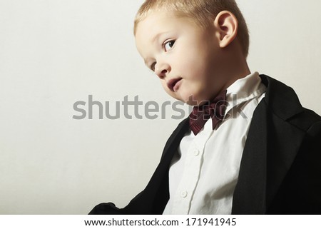 Funny Little Boy in Bow tie.Stylish kid. fashion children. 4 Years Old Child in Black Suit