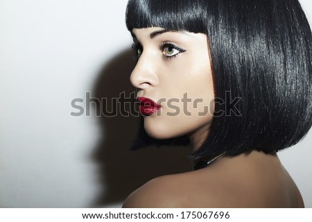 Beautiful Brunette Girl. Healthy Black Hair. bob Haircut. red lips. beauty woman