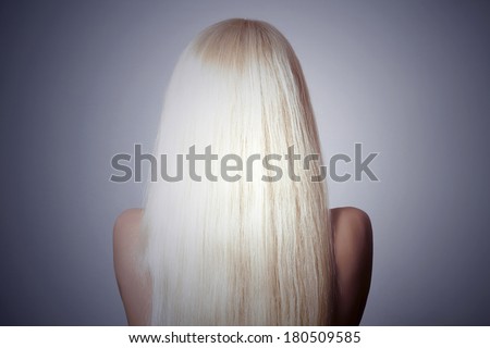 Blond Hair. Back side of Young Woman with Straight Hair. Abstract shot of Beauty Girl. Unusual