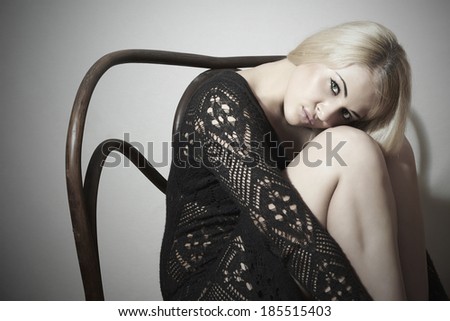 Beautiful blond Sad woman in dress.emotion.Sexy Body Girl. Sitting on Old bench