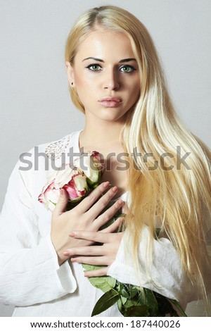 Beautiful Blond Woman with Roses.girl and Flowers.white bouquet