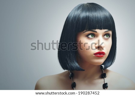 Beautiful Brunette Girl. Healthy Black Hair. bob Haircut. red lips. beauty woman