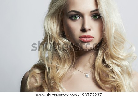 Fashion portrait of young beautiful woman. Green eyes & Pink lips. Sexy blonde. Blond girl. Curly hairstyle