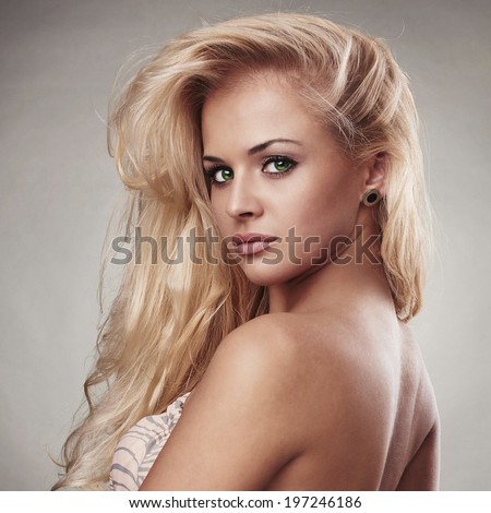 Sensitive Beautiful blond woman.hairstyle.sal on care.sexy girl. close-up portrait. green eyes
