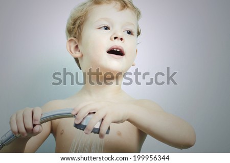 funny little boy in the shower.Bath.child