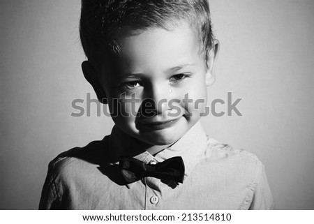 monochrome portrait of crying child. sad little boy.cry.tears on cheeks.emotion