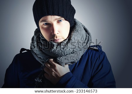 Fashionable Handsome Man in Scurf. Stylish Boy with Blue Eyes. Casual Winter Fashion