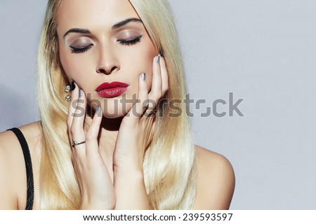 Beautiful blond Woman with Manicure. Sexy Beauty Girl. Nail design. Make-up. Beauty salon