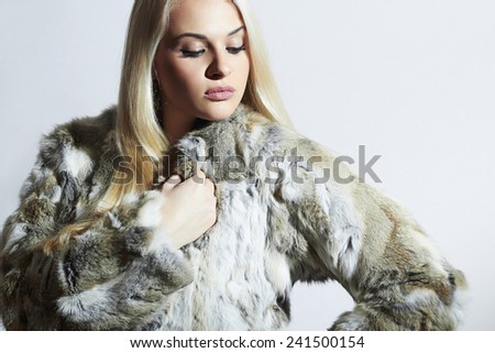 Beautiful woman in fur.winter fashion.Beauty blond Girl in Rabbit Fur Coat