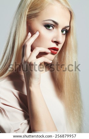 Young Blond woman with manicure.Beautiful girl model with make-up