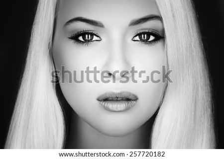 Beautiful Face of Young Woman.Blond girl.close-up.Art monochrome portrait.Beauty salon.Beautiful Young Model