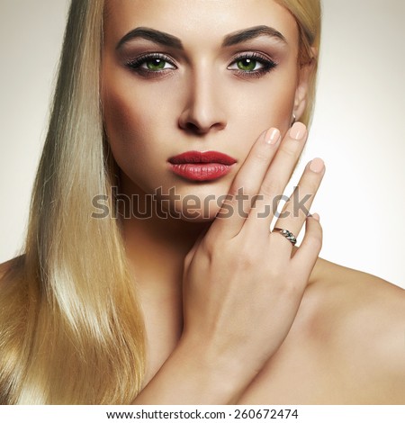 Fashion portrait of Young blond woman.Beautiful Girl with green eyes