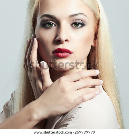Young Blond woman with manicure.Beautiful girl model with make-up