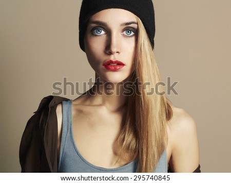 fashionable beautiful young woman in hat. beauty blond girl in cap. casual wear