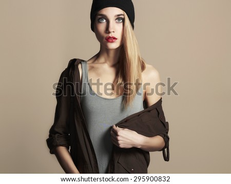 fashionable beautiful young woman in hat. beauty blond girl in cap. casual wear