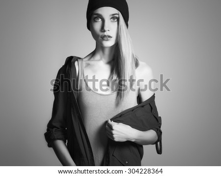 fashionable beautiful young woman in hat. beauty blond girl in cap. casual wear.autumn fashion collection