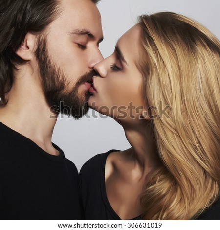 Kissing couple portrait.romantic beautiful woman and handsome man.lovely boy and girl