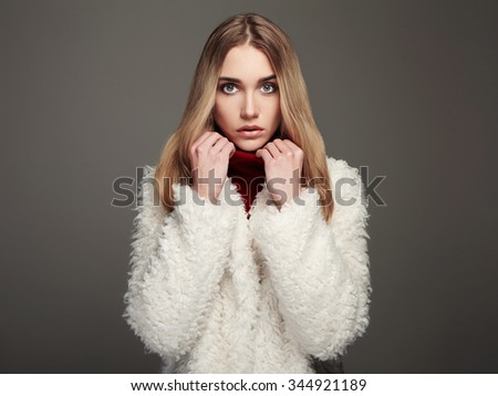 close-up portrait of beautiful winter girl in white fur. winter fashion beauty young woman