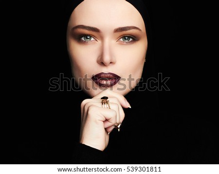 sensual beautiful woman,jewelry ring.female face like a mask. girl with make-up,purple lips.fashion portrait