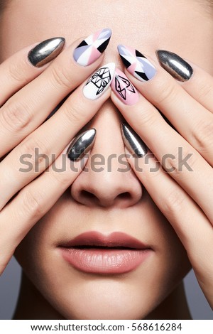 beautiful female hands cover her face.manicure. Close-up fashion Portrait.Model Girl Face. Make-up and nails