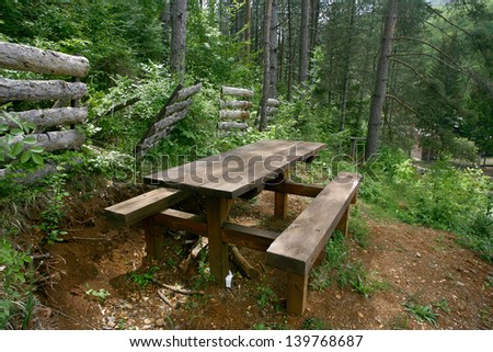 Picnic place in forest bench of wood in the woods