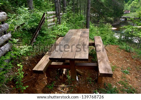 Picnic place in forest bench of wood in the woods
