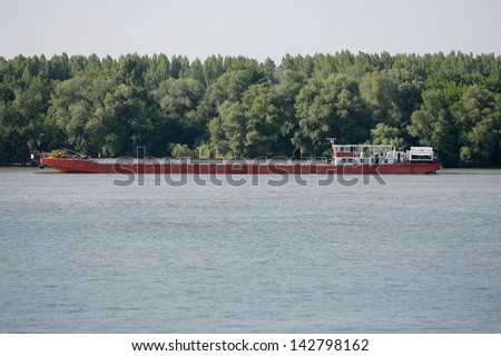push boat Barge pushed by towboat on the river freighter ship with sand