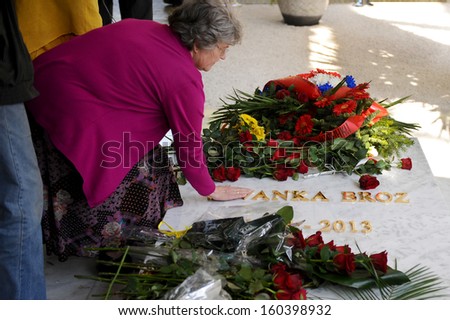 Belgrade, Serbia - October 26, 2013: People passing by the grave of Jovanka. Jovanka Broz, Yugoslavia\'s former First Lady built by her husband Josip Broz Tito in the House of Flowers mausoleum.