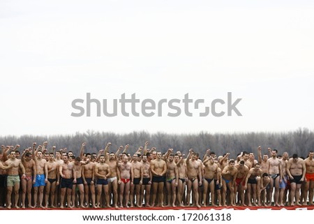 ZEMUN, SERBIA - JAN 19, 2014: Swimmers awaiting the start of the race. The Serbian Orthodox Church, traditionally Epiphany with competitions to retrieve the Holy Cross from Danube river in Zemun.