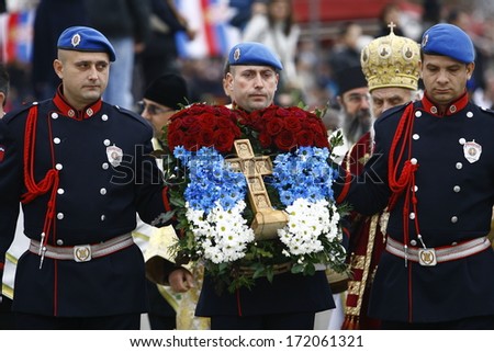 ZEMUN, SERBIA - JAN 19, 2014: Members of the police carry Holy Cross. The Serbian Orthodox Church, traditionally Epiphany with competitions to retrieve the Holy Cross from Danube river in Zemun.