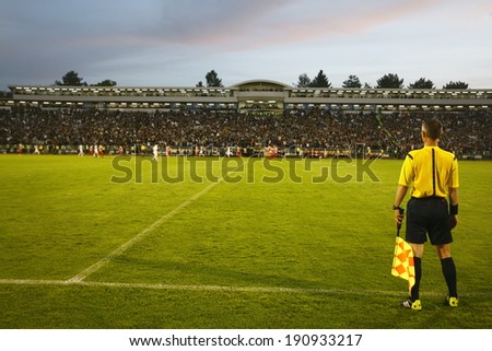 SERBIA, BELGRADE - APRIL 27, 2014: The referee during the match. Eternal rivals have met 146th times in the Eternal soccer derby, FC Partizan and Red Star from Belgrade, was played on 27 April.