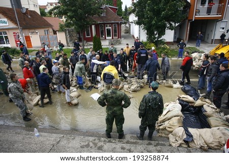 SERBIA, SREMSKA MITROVICA - MAY 17: The army and citizens raise the walls banks with sandbags.The water level of Sava River remains high in worst flooding on record across the Balkans on may 17, 2014