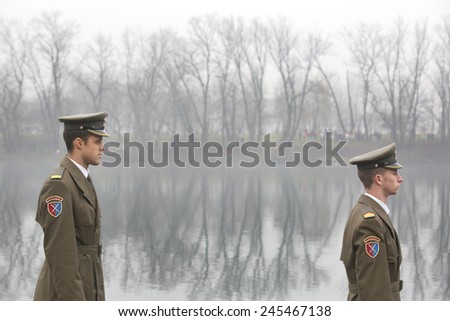 BELGRADE, SERBIA - JAN 19, 2015: Young army cadets provide ceremony. Orthodox Christians celebrate Epiphany with traditional ice swimming in Belgrade.