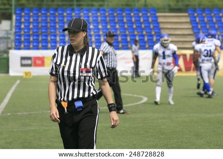 Belgrade, Serbia - May 05, 2014: The only female football referee Ivana Lazic in Serbia. American Football Match Between Belgrade Wolves And Blue Dragon in Belgrade. The Wolves team is winner.
