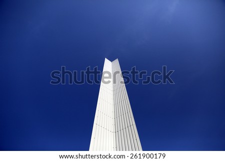 Architectural Detail of steel metal in down side a modern geometry with blue sky background with copy space