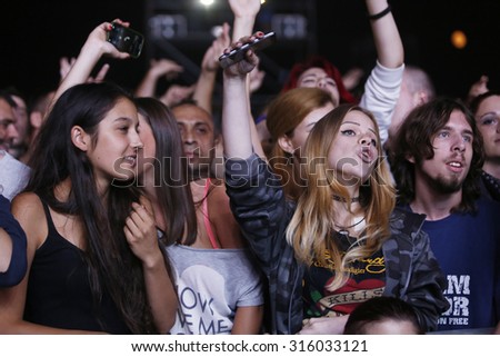 Belgrade, Serbia - August 20, 2015: The audience during a show at Traditional Beer Fest in Belgrade, next to good music to audience offered and beer, this year lasted 6 days.