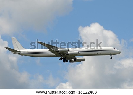 Unmarked cargo jet airplane landing side view
