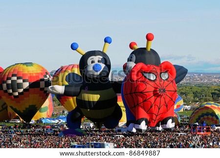ALBUQUERQUE, NM - OCTOBER 8: Crowds cheer hot air balloon flight crews during the annual International Balloon Fiesta in Albuquerque, NM on October 8, 2011.