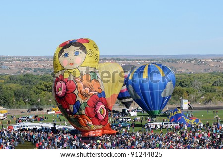 ALBUQUERQUE - OCTOBER 8: Crowds cheer hot air balloon flight crews during the annual International Balloon Fiesta in Albuquerque, NM on October 8, 2011