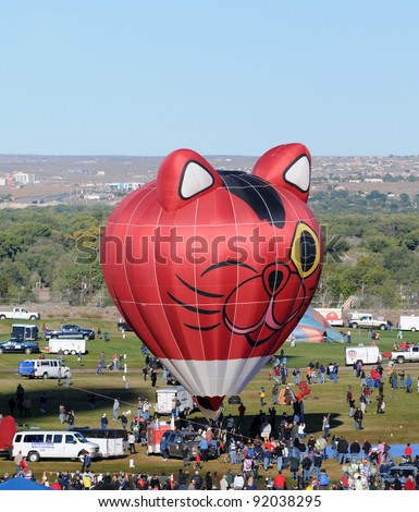 ALBUQUERQUE - NOVEMBER 8: Crowds cheer hot air balloon at the annual International Balloon Fiesta. The event took place on November 8, 2011 in Albuquerque, New Mexico, USA